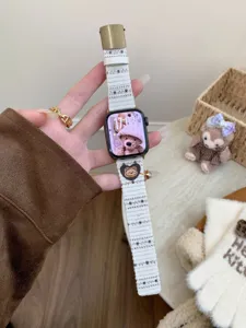 Corduroy Apple Watch strap with cute bear charm and star pattern, comfortable daily wear accessory.