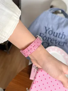 Pink jelly polka dot TPU sports watch band detail, compatible with Apple smart watch.