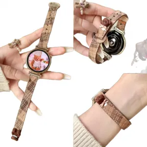 Brown plaid smartwatch strap with cute bear charm and matching ring, stylish accessory.