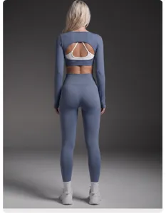 Seamless activewear set featuring a long sleeve open back crop top and high waist leggings.