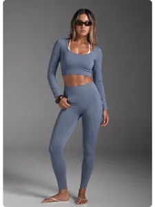 Seamless long sleeve activewear crop top and high waist leggings yoga fitness detail view.