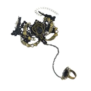 Gothic vintage black lace slave bracelet with bronze alloy charms and black stone ring.