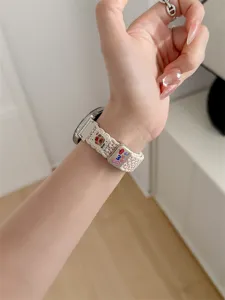 Detailed view of the cute woven watch strap with lovely bear embroidery and sweet style.