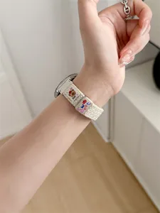 Woven watch strap detail view, compatible with Huawei smartwatch, featuring cute bear design.