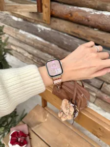 Close-up of stylish striped wave leather watch strap in cozy autumn and winter style.