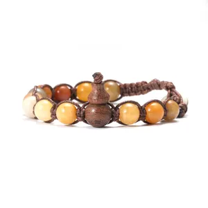 Bracelet tressé en pierre naturelle œil de tigre agate et gourde en bois détail parfait.