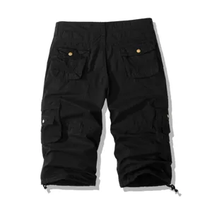 Detailed look at men's black cargo shorts featuring multiple pockets and knee length fit.