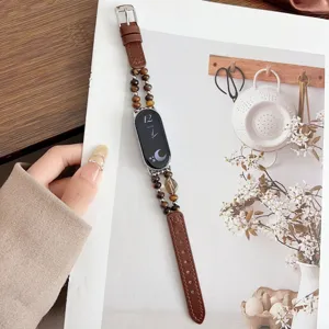 Cinturino di ricambio in pelle con perle di cristallo compatibile con fitness tracker.