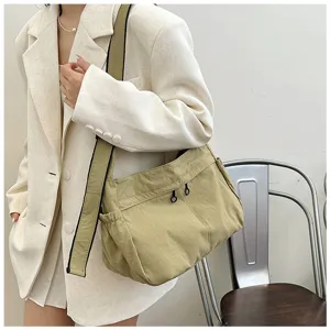 Detail view of casual nylon utility crossbody shoulder bag for women, spacious everyday style.