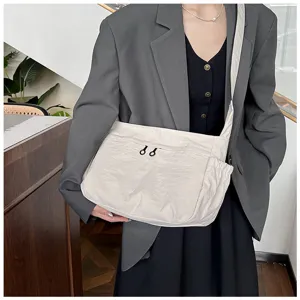 Detail view of the casual nylon crossbody shoulder bag, highlighting functional daily utility.