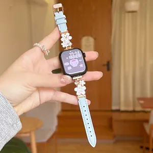 Metal flower leather watch strap compatible with Apple Watch series, stylish blue band.