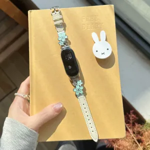 Metal flower leather smart watch band replacement strap with elegant mint green floral charms.