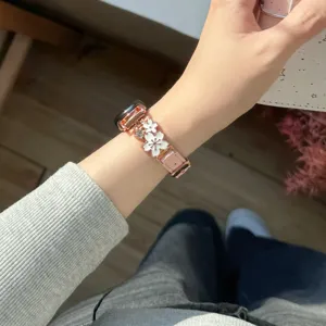 Metal floral spliced leather replacement watch strap compatible with Apple Watch series, stylish accessory.