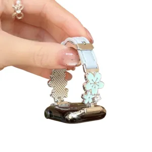 Elegant floral metal and leather watch strap compatible with Apple Watch series, stylish accessory.