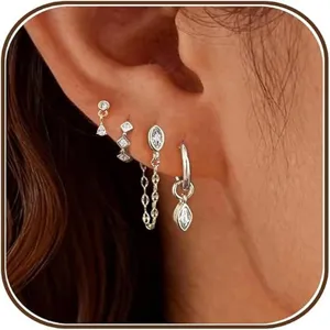 Close-up detail shot of multi-piece zirconia earrings set showcasing various chic stud and hoop designs.