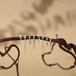 Silver tone cubic zirconia multi-piece earring set featuring studs, hoops, and chains.