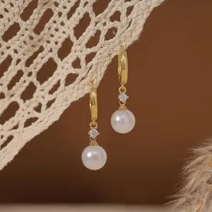 French style pearl dangle earrings with gold hoop, sparkling zirconia and elegant white pearl.