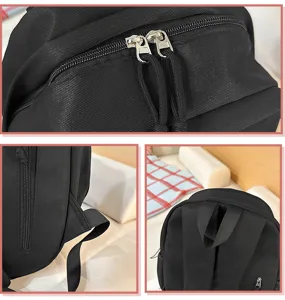 Vista dettagliata dello zaino casual nero semplice da donna, tessuto resistente, uso quotidiano.