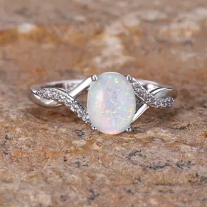 Elegant sterling silver oval white opal ring with sparkling pavé twisted bands for women.