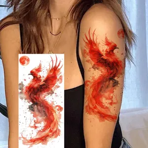 Waterproof temporary tattoo sticker featuring a vibrant red phoenix design, perfect for arm wear.