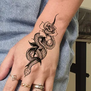 Temporary tattoo sticker featuring a chic snake and rose design for hand body art.