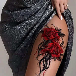 Waterproof red rose temporary tattoo sticker for thigh and arm, realistic floral body art design.