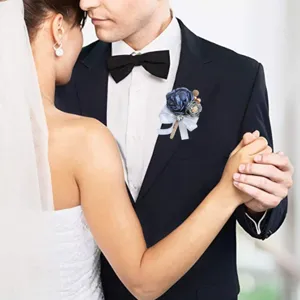 Korean wedding groom boutonniere detail, blue fabric flower brooch with white bow and pearls.