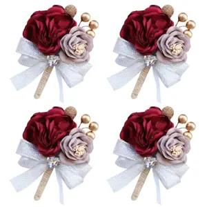 Elegant wedding boutonniere set featuring artificial fabric roses, silver ribbon and crystal.