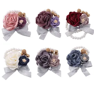 Set of 6 Korean style wedding fabric rose corsages with pearl strings and silver bows for bride.