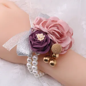 Exquisite artificial wedding wrist corsage featuring pink purple flowers and elegant pearls.