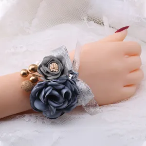 Elegant grey fabric rose wrist corsage with sparkling silver ribbon for wedding party