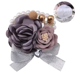 Elegant wedding fabric rose corsage with pearls, silver ribbon and crystal heart detail.
