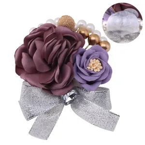 Korean style artificial flower wedding corsage with purple roses, pearls, and silver bow.