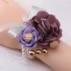 Korean style wedding wrist corsage bracelet with purple fabric flowers and pearl chain.