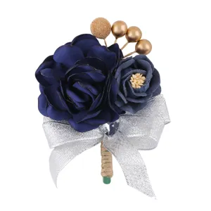 Exquisite blue fabric flower boutonnière with gold beads and silver glitter ribbon detail.