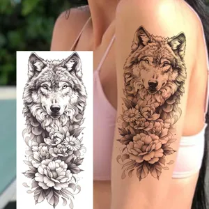 Temporary tattoo sticker featuring a fierce wolf and floral peony design for arm and leg.