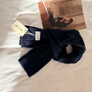 Thick warm solid color knitted scarf for women, cozy winter wool blend neckerchief accessory.