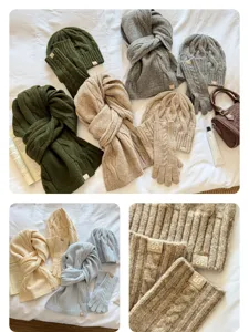 Winter three-piece knitted set including scarf, beanie and gloves with solid cable knit design.
