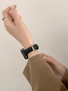 Detailed view of replacement leather watch band for smart watch, elegant curved style, metal buckle.