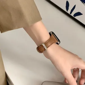Brown leather watch strap compatible with Apple Watch SE series, slim design, premium wristband.