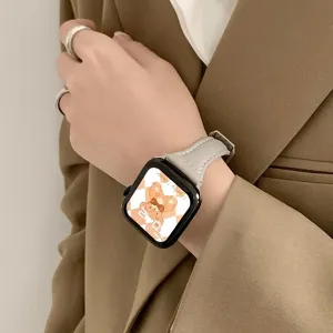 Elegant grey leather replacement watch strap for smart watch, stylish commuter accessory.