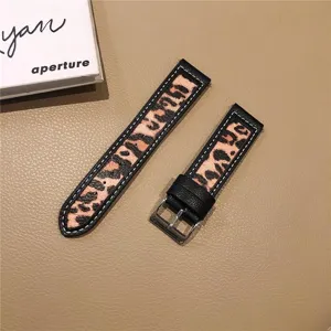 Leopard print watch strap detail, premium leather and canvas texture with metal buckle.