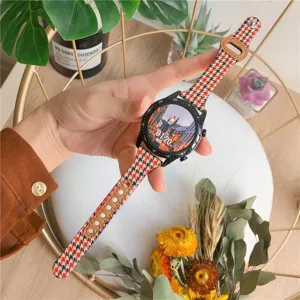 Λεπτομερής όψη ανταλλακτικού λουριού smartwatch από καμβά houndstooth και δέρμα.