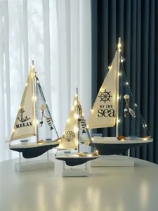 Ocean style decorative wooden sailboat model with LED lights, perfect home decor gift.
