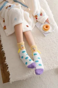 Thickened coral fleece cartoon socks with funny embroidery and cute 3D design details.