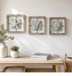 Mediterranean coastal style wall art featuring starfish and seashell plaques for home decor.