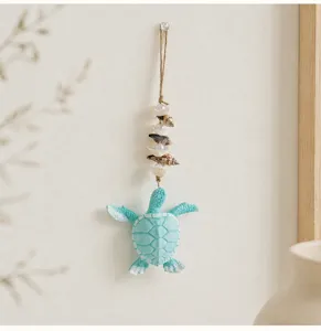 Mediterranean style sea turtle seashell hanging wall decor with beads and natural shell accents.