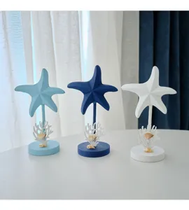 Marine style starfish decorative ornament, wooden craft desktop decor with coral and shells detail view.