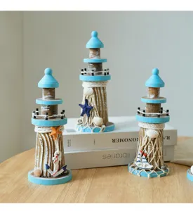 Mediterranean style wooden lighthouse tabletop ornament set with distressed blue finish.