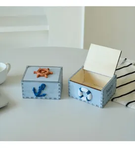 Mediterranean style wooden storage box with anchor and lifebuoy decoration for desktop.